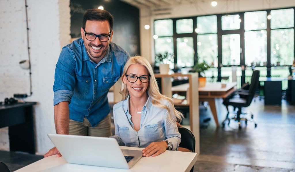 male and female working at desk